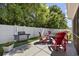 Backyard patio features a built in grill and space for outdoor seating around a fire pit at 284 Whipple Run, Myrtle Beach, SC 29588