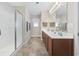 Bathroom featuring a glass shower and vanity with double sinks and a full mirror at 284 Whipple Run, Myrtle Beach, SC 29588
