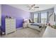 This bedroom is stylish with a colorful purple and gray color scheme and carpet flooring at 284 Whipple Run, Myrtle Beach, SC 29588