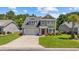 Charming two-story home featuring a well-maintained lawn, two car garage, and inviting front porch at 284 Whipple Run, Myrtle Beach, SC 29588