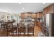 Spacious kitchen with granite countertops, stainless steel appliances, and center island with bar stool seating at 284 Whipple Run, Myrtle Beach, SC 29588