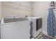 Laundry room with a washer, dryer, and ironing board at 284 Whipple Run, Myrtle Beach, SC 29588