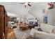 Open-concept living room featuring hardwood floors, staircase, and lots of natural light at 284 Whipple Run, Myrtle Beach, SC 29588