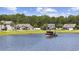 A view showcasing a serene pond with a boat, enhancing the property's appeal at 284 Whipple Run, Myrtle Beach, SC 29588