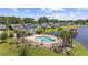 A community pool with lounge chairs and palm trees, offering a refreshing oasis for residents at 284 Whipple Run, Myrtle Beach, SC 29588