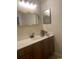 Bathroom with vanity, mirror, and decorative flower accent at 3017 Mercer Dr. # 0, Conway, SC 29526