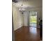 A well-lit dining area features hardwood floors and sliding glass doors to an outdoor view at 3017 Mercer Dr. # 0, Conway, SC 29526