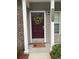 Charming front entrance features a lovely wreath, decorative door mat and the house number at 3017 Mercer Dr. # 0, Conway, SC 29526