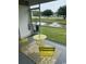 Relaxing screened porch overlooking a serene pond with a fountain at 3017 Mercer Dr. # 0, Conway, SC 29526