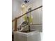 The stairwell landing features a wooden railing and an ornamental bird at 3017 Mercer Dr. # 0, Conway, SC 29526
