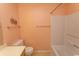 Neutral bathroom featuring toilet, decor, shower and tub combo at 305 N Hillside Dr. # 206, North Myrtle Beach, SC 29582