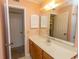 Neutral bathroom featuring a sink, mirror, cabinet, and doors at 305 N Hillside Dr. # 206, North Myrtle Beach, SC 29582