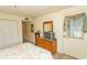 Comfortable bedroom with a closet, a dresser with a mirror, and a window providing natural light at 305 N Hillside Dr. # 206, North Myrtle Beach, SC 29582
