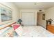 Bright bedroom features a plush bed, dresser, closet, and soothing artwork on the wall at 305 N Hillside Dr. # 206, North Myrtle Beach, SC 29582