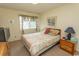 Cozy bedroom with a double bed, a window with curtains, and wooden furniture at 305 N Hillside Dr. # 206, North Myrtle Beach, SC 29582