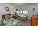Cozy bedroom with two twin beds and outdoor views at 305 N Hillside Dr. # 206, North Myrtle Beach, SC 29582