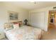 Bedroom with a comfortable bed, closet space, and a picturesque wall painting above the bed at 305 N Hillside Dr. # 206, North Myrtle Beach, SC 29582