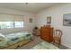 Bright bedroom featuring two twin beds and outdoor views at 305 N Hillside Dr. # 206, North Myrtle Beach, SC 29582
