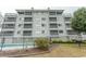 Multi-story building with screened-in patios and community pool at 305 N Hillside Dr. # 206, North Myrtle Beach, SC 29582