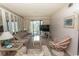 Inviting living room with comfortable seating, a sliding door to the patio, and a flat-screen TV at 305 N Hillside Dr. # 206, North Myrtle Beach, SC 29582