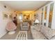 Open-concept living area with a dining table, comfortable seating, and decorative wall mirrors at 305 N Hillside Dr. # 206, North Myrtle Beach, SC 29582