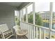 Inviting screened patio featuring a scenic lake view and outdoor seating at 305 N Hillside Dr. # 206, North Myrtle Beach, SC 29582