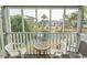 Cozy screened patio offers tranquil water views and comfortable seating at 305 N Hillside Dr. # 206, North Myrtle Beach, SC 29582