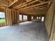 The new home interior has concrete flooring and framed walls ready to be finished at 3072 Palma Way, Myrtle Beach, SC 29579