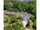 An aerial shot of a well-maintained house, surrounded by lush greenery and mature trees in a quiet neighborhood at 4 Clemson Rd., Conway, SC 29526
