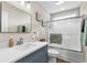 Bright bathroom with a glass shower door, framed mirror, and vanity with clean, white countertop at 4 Clemson Rd., Conway, SC 29526