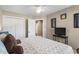 Comfortable bedroom with large closet and neutral walls, featuring a mounted TV on the side table at 4 Clemson Rd., Conway, SC 29526