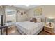 Cozy bedroom featuring a queen-sized bed, neutral colors and natural light from the nearby window at 4 Clemson Rd., Conway, SC 29526