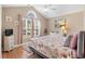 Cozy bedroom with tray ceiling, ceiling fan, ample natural light, and stylish decor perfect for relaxation at 4 Clemson Rd., Conway, SC 29526