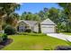 Well-maintained one-story home featuring a lush lawn and attached two-car garage at 4 Clemson Rd., Conway, SC 29526