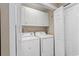Functional laundry closet with a washer and dryer, and built-in shelving for added storage at 4 Clemson Rd., Conway, SC 29526