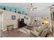 Spacious living room with vaulted ceiling, modern fan, and comfortable furnishings at 4 Clemson Rd., Conway, SC 29526