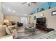 Inviting living room with neutral tones, a large ceiling fan, and stylish decor at 4 Clemson Rd., Conway, SC 29526