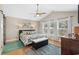 Bright main bedroom with vaulted ceiling, ceiling fan, three windows, and stylish decor with ensuite at 4 Clemson Rd., Conway, SC 29526