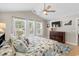 Spacious main bedroom features a tray ceiling, windows, ceiling fan, and an ensuite bathroom at 4 Clemson Rd., Conway, SC 29526