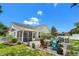 Cozy outdoor patio area features comfortable seating, a fire pit, and manicured landscaping with beautiful pavers at 4 Clemson Rd., Conway, SC 29526