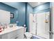 Bathroom with a glass shower, vanity with sink, and a framed artwork on the wall at 402 Toledo St., Conway, SC 29526
