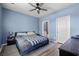 A stylish bedroom features a ceiling fan, a comfortable bed, and a private bathroom entrance at 402 Toledo St., Conway, SC 29526