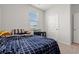 Comfortable bedroom with a large window, soft carpet, and cozy bed, offering a peaceful retreat at 402 Toledo St., Conway, SC 29526