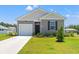Charming single-story home featuring a one-car garage, nicely manicured lawn, and classic curb appeal at 402 Toledo St., Conway, SC 29526
