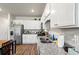 Functional kitchen featuring granite countertops, stainless steel appliances, and ample white cabinetry at 402 Toledo St., Conway, SC 29526