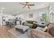 Open concept living area with a kitchen and dining area, ceiling fan, and comfortable seating at 402 Toledo St., Conway, SC 29526
