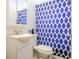 Small bathroom with blue patterned shower curtain at 404 13Th Ave. S, Myrtle Beach, SC 29577
