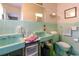 Retro bathroom featuring dual sinks and mint green tile at 404 13Th Ave. S, Myrtle Beach, SC 29577