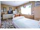 Bright bedroom with wood-paneled walls and carpeted floor at 404 13Th Ave. S, Myrtle Beach, SC 29577