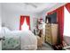 Bright bedroom with a large bed and red curtains at 404 13Th Ave. S, Myrtle Beach, SC 29577